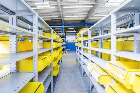 Empty warehouse interior with shelves, pallets , boxes and equipment Stock Photos