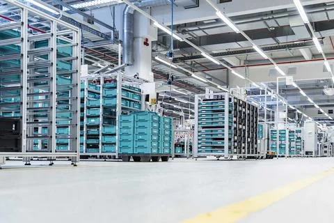 Empty warehouse interior with shelves, pallets , boxes and equipment Stock Photos