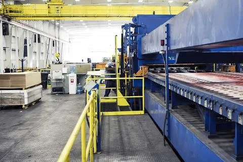 Empty warehouse interior with shelves, pallets, boxes and equipment Stock Photos