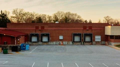 Empty Warehouse Loading Dock and Parking Lot Stock Photos
