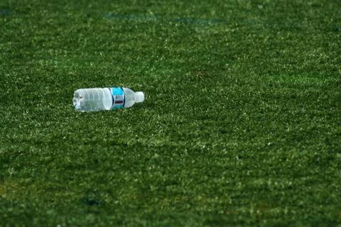 Empty water bottle on grass Stock Photos