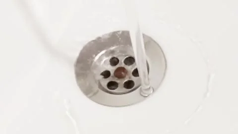 Empty water flowing from the tap into the sink Stock Footage 276348144