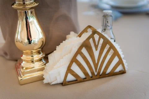 Empty Wedding Reception Hall Decor Detail of Napkin Holder and Gold Candlestick Stock Photos