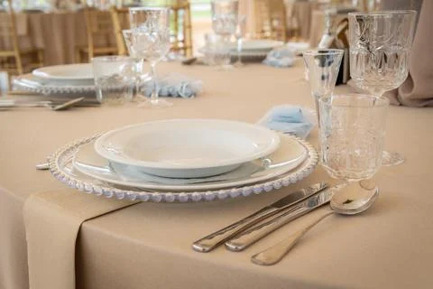 Empty Wedding Reception Hall Table Setting With Plates, Cutlery, and Glasses Stock Photos