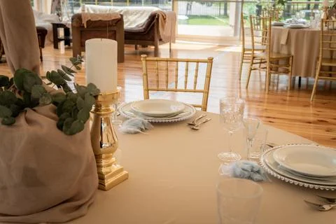 Empty Wedding Reception Hall Table Setting With White Plates and Candles Stock Photos