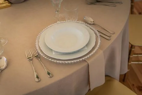 Empty Wedding Reception Hall Table Setting With Silverware and Plates Stock Photos