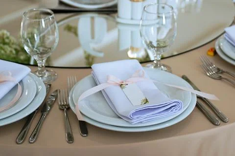 Empty Wedding Reception Hall Table Setting With glasses and Plates Stock Photos
