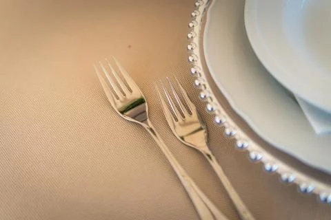 Empty Wedding Reception Table Setting With Forks and Plates Stock Photos