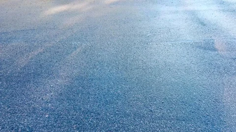 Empty wet asphalt surface in cold daylight, city road texture Stock Footage 330300380