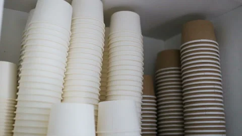 Empty white and brown disposable paper cups for coffee, ice cream and other cold Stock Footage 93514466