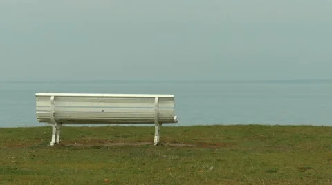 Empty white bench with a view on the sea. End of the season. Stock Footage 44249494
