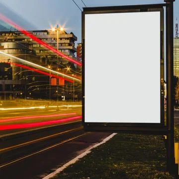 Empty white billboard with light trails city night Beautiful photo Stock Photos