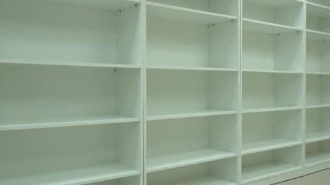 Empty white bookshelf indoor to store documents.Switching off light in office Stock Footage 251772427