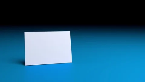 Empty White Card spinning in the Air on blue background, Loopable Video, 3d R Stock Footage 90535015