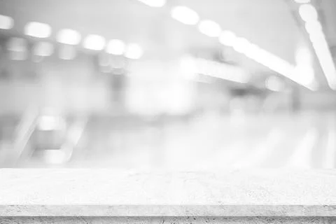 Empty white cement table over blur store background, product display montage Stock Photos