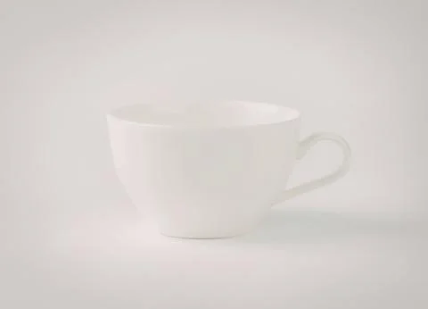 Empty white ceramic coffee cup with handle Photos