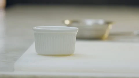 Empty white ceramic mold on a chopping board. Stock Footage 321356554