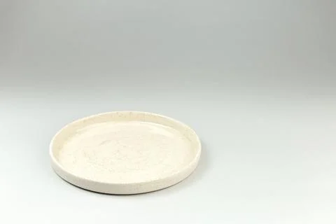 Empty White Ceramic Plate on gray background Stock Photos