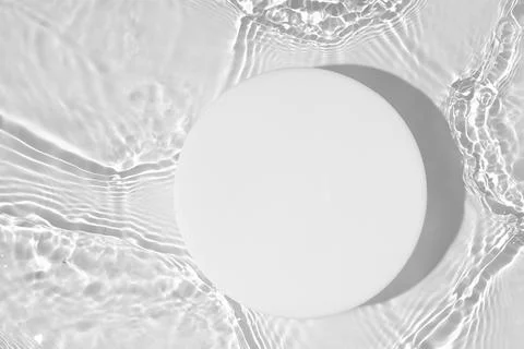Empty white circle podium on transparent clear water background with copy space Stock Photos