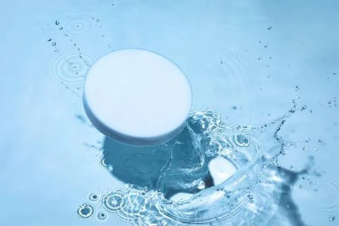 Empty white circle podium on transparent blue water background with copy space Stock Photos