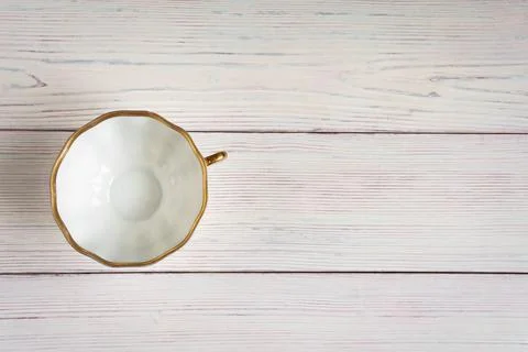 Empty white Cup on light old wooden background. Stock Photos