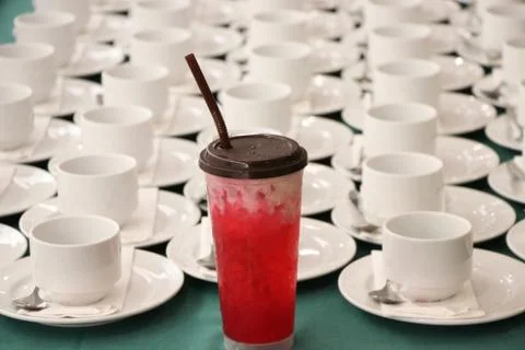 The empty white cups with spoons put on table waiting guests on the table Stock Photos