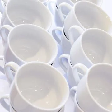 Empty White Cups Stacked on the Table. Tea or Coffee Catering Services at the Stock Photos