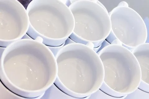 Empty White Cups Stacked on the Table. Tea or Coffee Catering Services at the Foto stock
