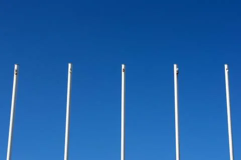 Empty white flag poles Stock Photos