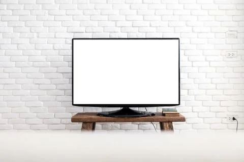 Empty white flat TV screen hanging on a white wall. Foto stock
