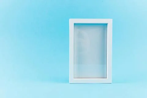 Empty white frame on blue Stock Photos