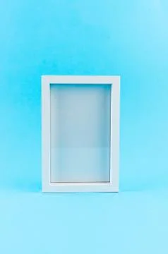 Empty white frame on blue 스톡 사진