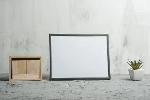 Empty white frame with flower and calendar on wall background. The concept of Stock Photos