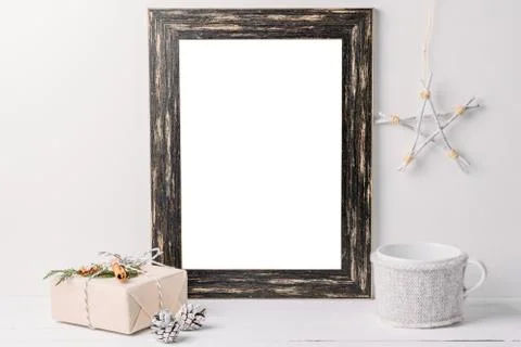 Empty white frame mock up. Black wooden frame mockup with christmas decoratio Stockfoto's