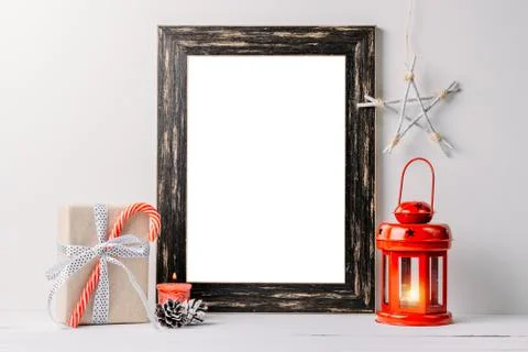 Empty white frame mock up. Black wooden frame mockup with christmas decoratio Stockfoto's
