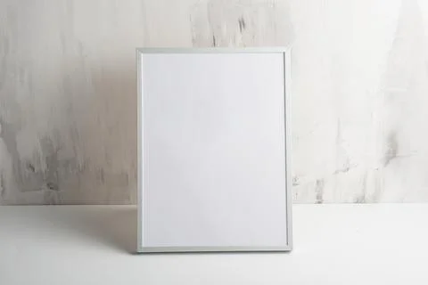 Empty white frame on the wall background. The concept of design and font insc Stock Photos