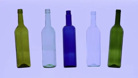 Empty white green and blue bottles are dancing Video stock 142442376