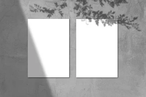 Empty white horizontal rectangular poster mockup with light shadow on gray co Stock Photos
