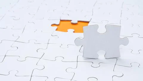 Empty white jigsaw puzzle with  missing piece 스톡 사진