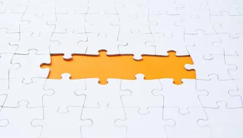 Empty white jigsaw puzzle with missing pieces Empty white jigsaw puzzle wi... Stock Photos