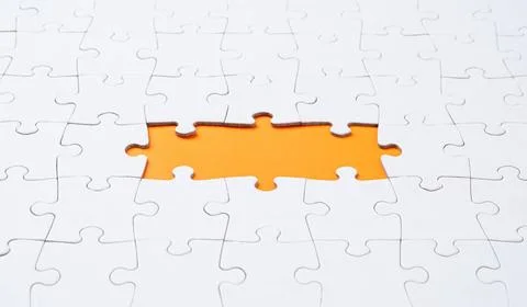 Empty white jigsaw puzzle with missing pieces Empty white jigsaw puzzle wi... Stock Photos