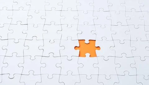 Empty white jigsaw puzzle with missing piece Empty white jigsaw puzzle wit... Stock Photos