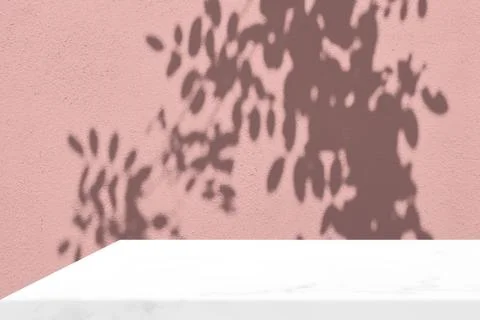 Empty White Marble Table Corner with Leaves Shadow on Pink Wall Background Stock Photos