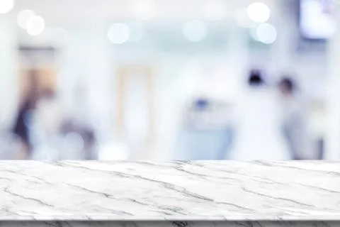 Empty white marble table top with blur patient waiting for doctor at hospital Stock Photos