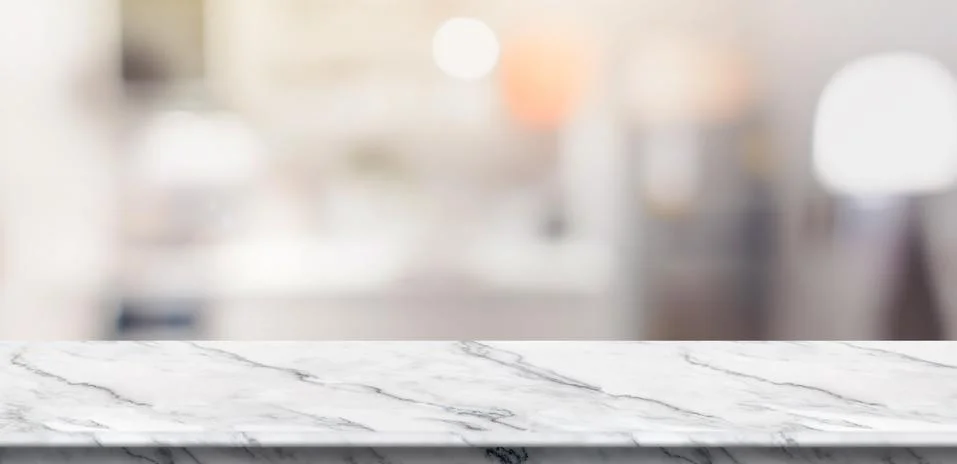 Empty white marble table top food stand with blur house kitchen background bo Stock Photos