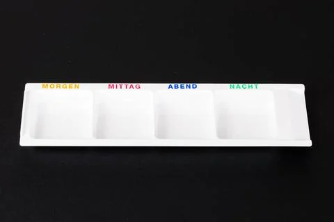 An empty white medicine box for the daily organizing of medication, displa... Stock Photos