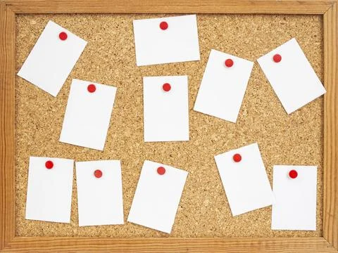 Empty white paper notes pinned and scattered on a cork board , abstract bus.. Stock Photos