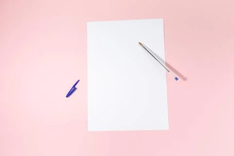 Empty white paper sheet and a pen on pink background. Mockup Stock Photos