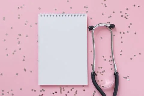 Empty white paper sheet notebook and stethoscope or phonendoscope Stock Photos