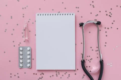 Empty white paper sheet notebook, blister tablet, stethoscope or phonendoscop Stock Photos